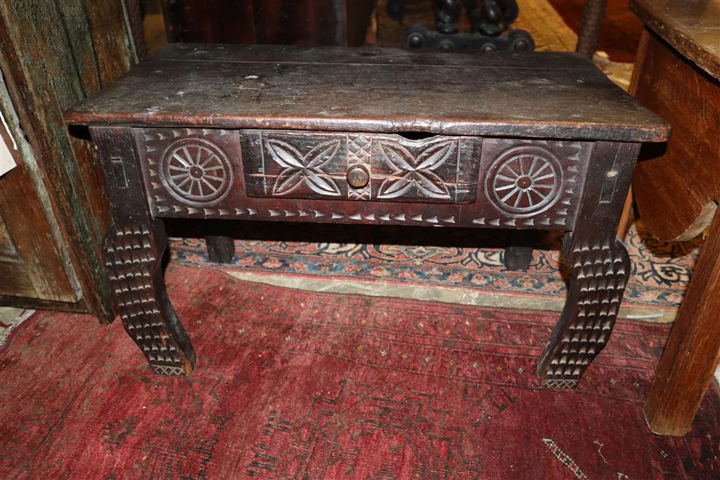 An 18th century oak wall cabinet, width 55cm, depth 28cm, height 61cm together with a commode and chip carved bow table